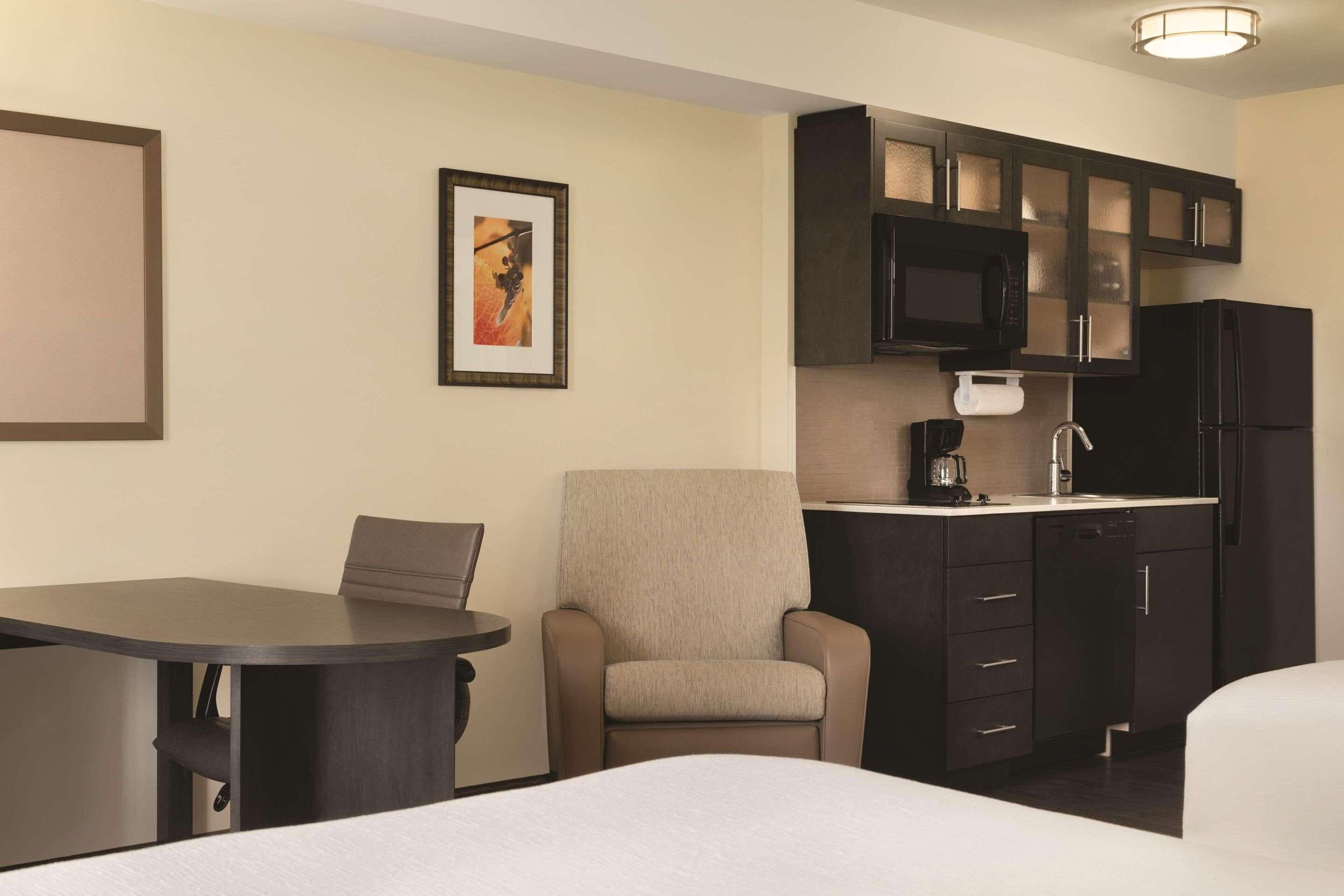 pillow-top beds, desk, laptop workspace, blackout curtains