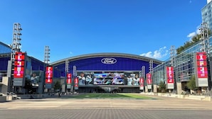A large stadium with a prominent Ford logo and multiple large digital displays. - Hilton Garden Inn The Colony Dallas (The Colony)