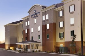 A multi-story hotel with a prominent sign reading 'CANDLEWOOD SUITES'. - Candlewood Suites Vestal - Binghamton by IHG (Vestal)