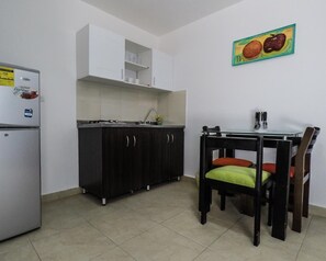 Fridge, stovetop, coffee/tea maker, cookware/dishes/utensils