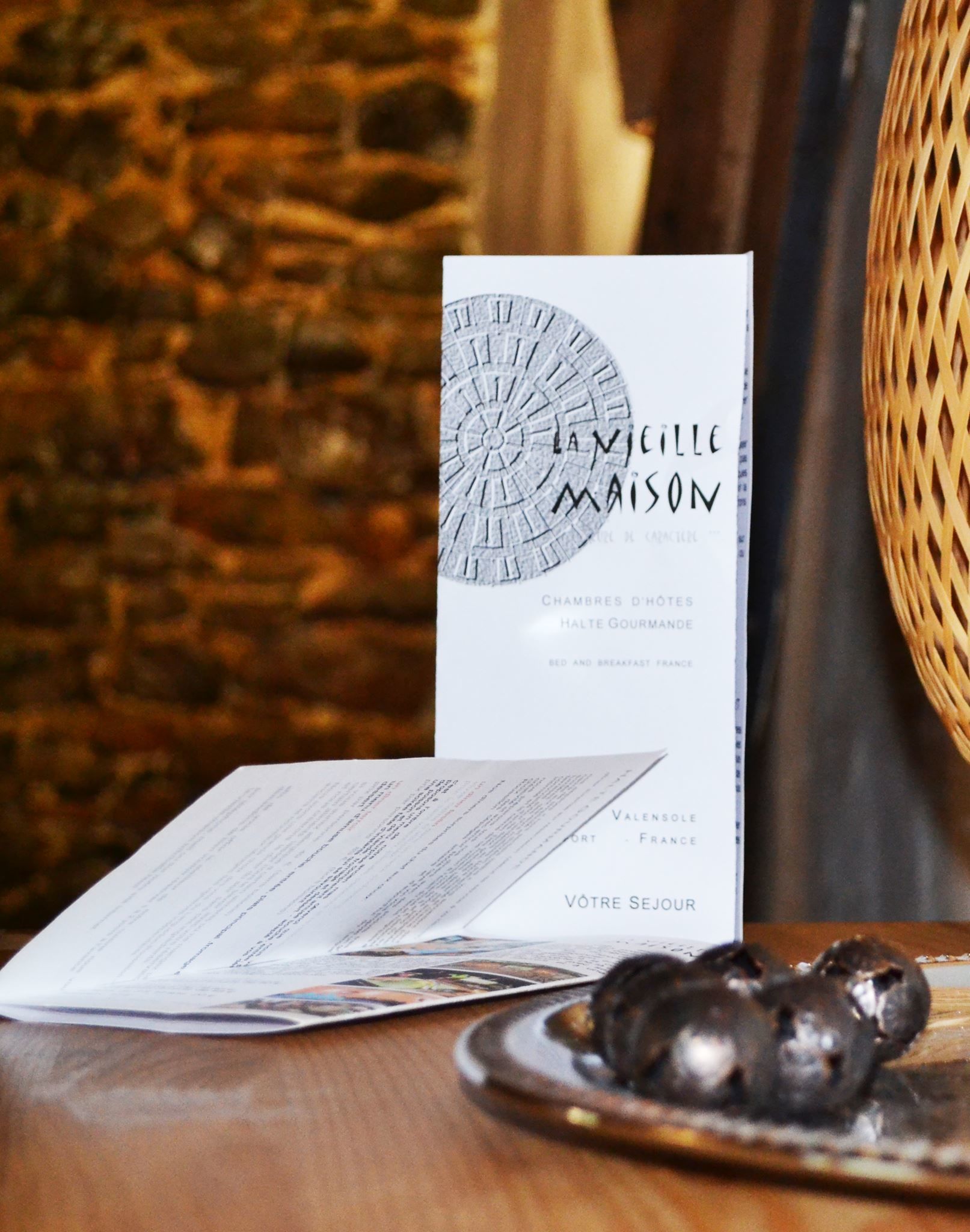 A menu titled "La Vieille Maison" with a rustic background.