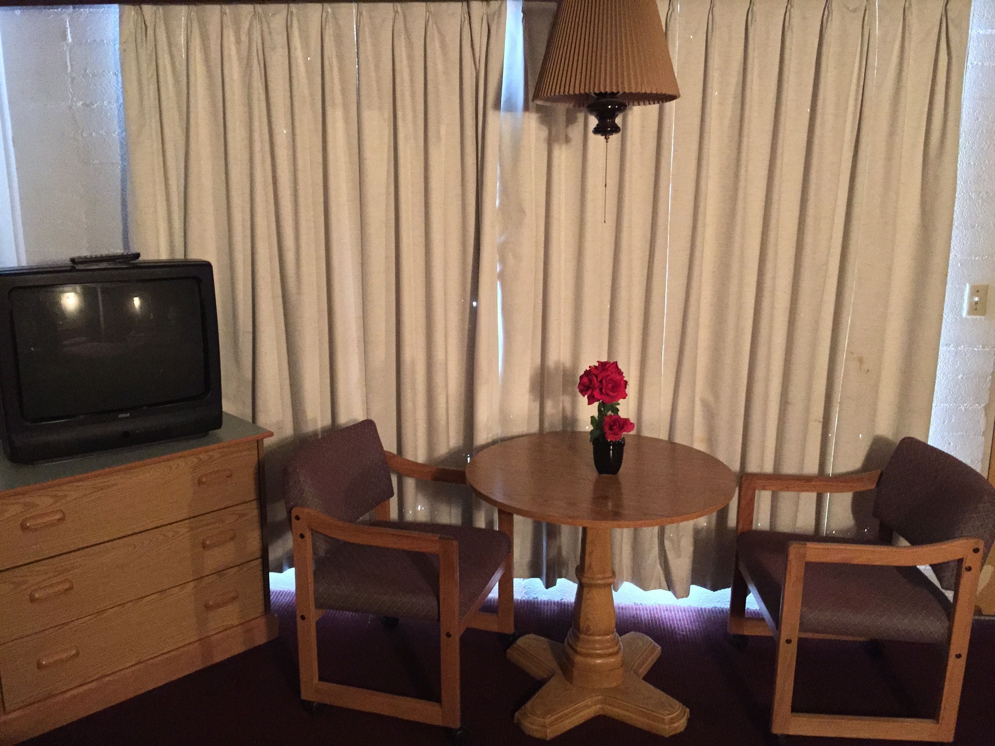 Room, 2 Double Beds | Living area | 27-inch TV with cable channels