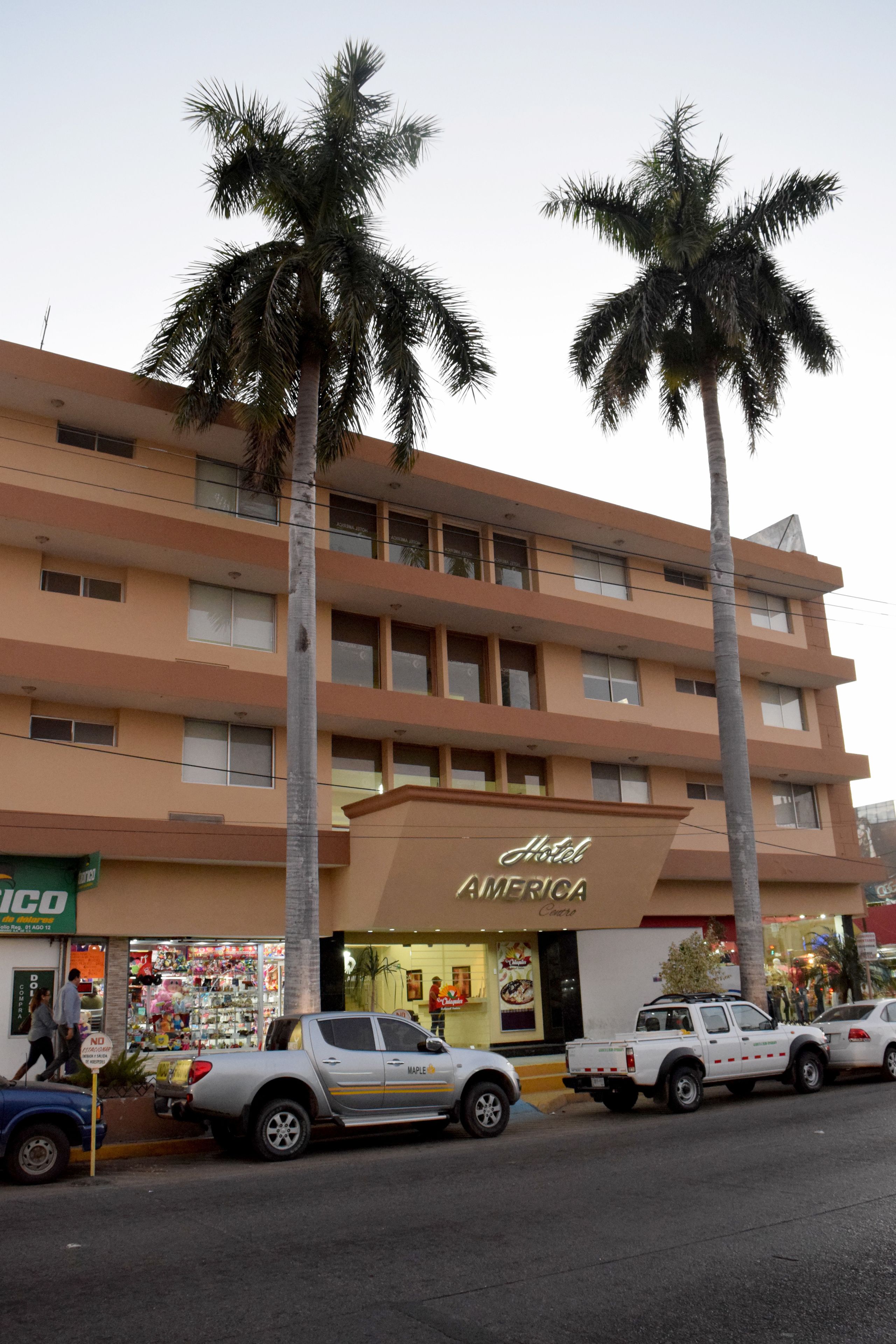 A multi-story hotel with a prominent sign reading "Hotel America."