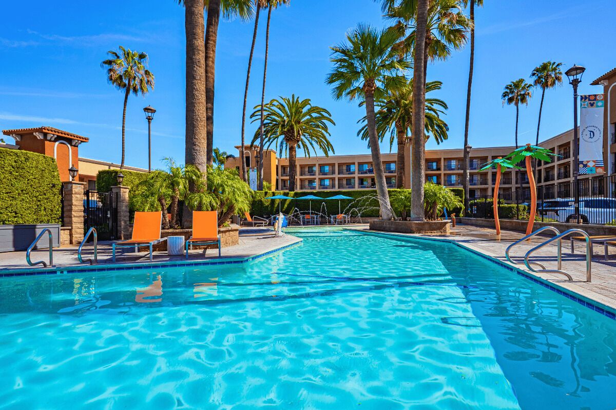 Outdoor pool, open 8:00 AM to 10:00 PM, pool umbrellas, sun loungers