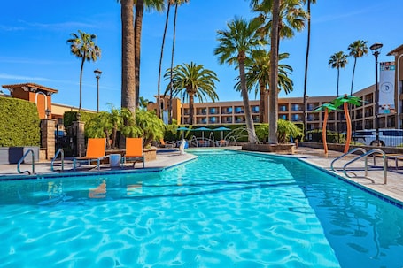 Outdoor pool, open 8:00 AM to 10:00 PM, pool umbrellas, sun loungers. Grand Legacy At the Park