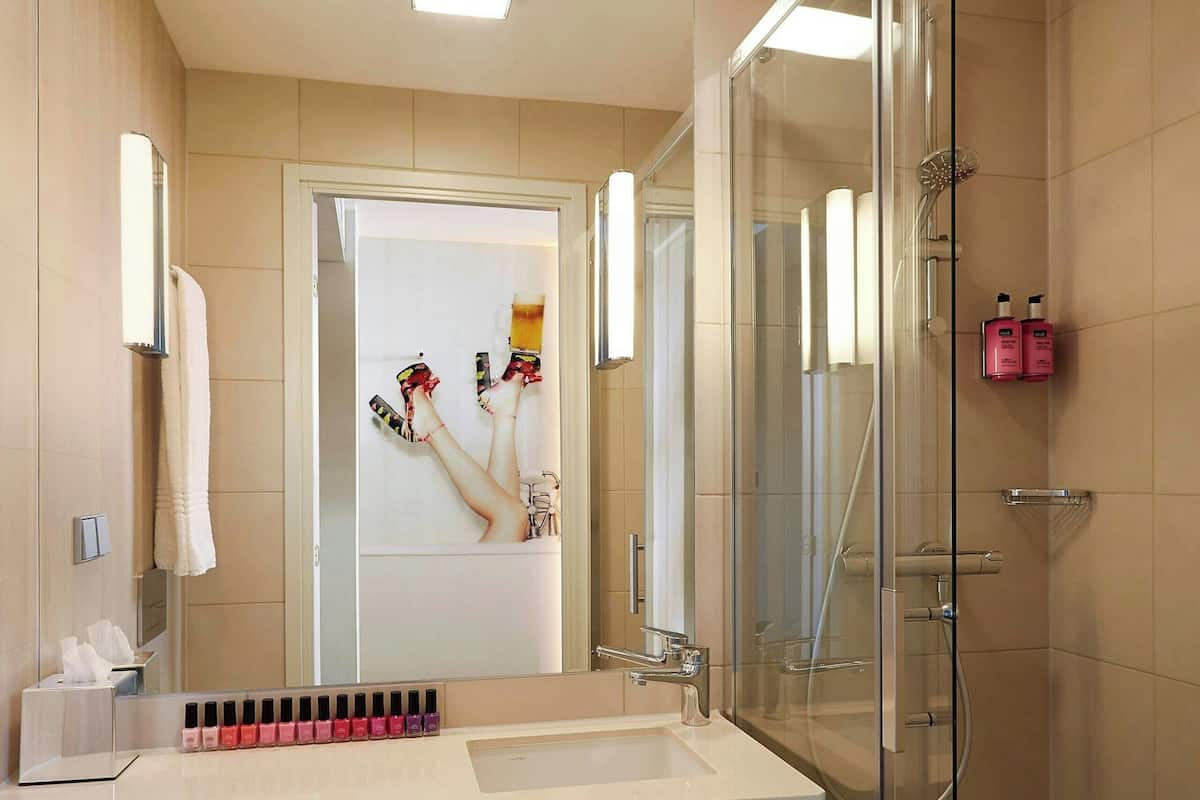 shower, designer toiletries, hair dryer, towels