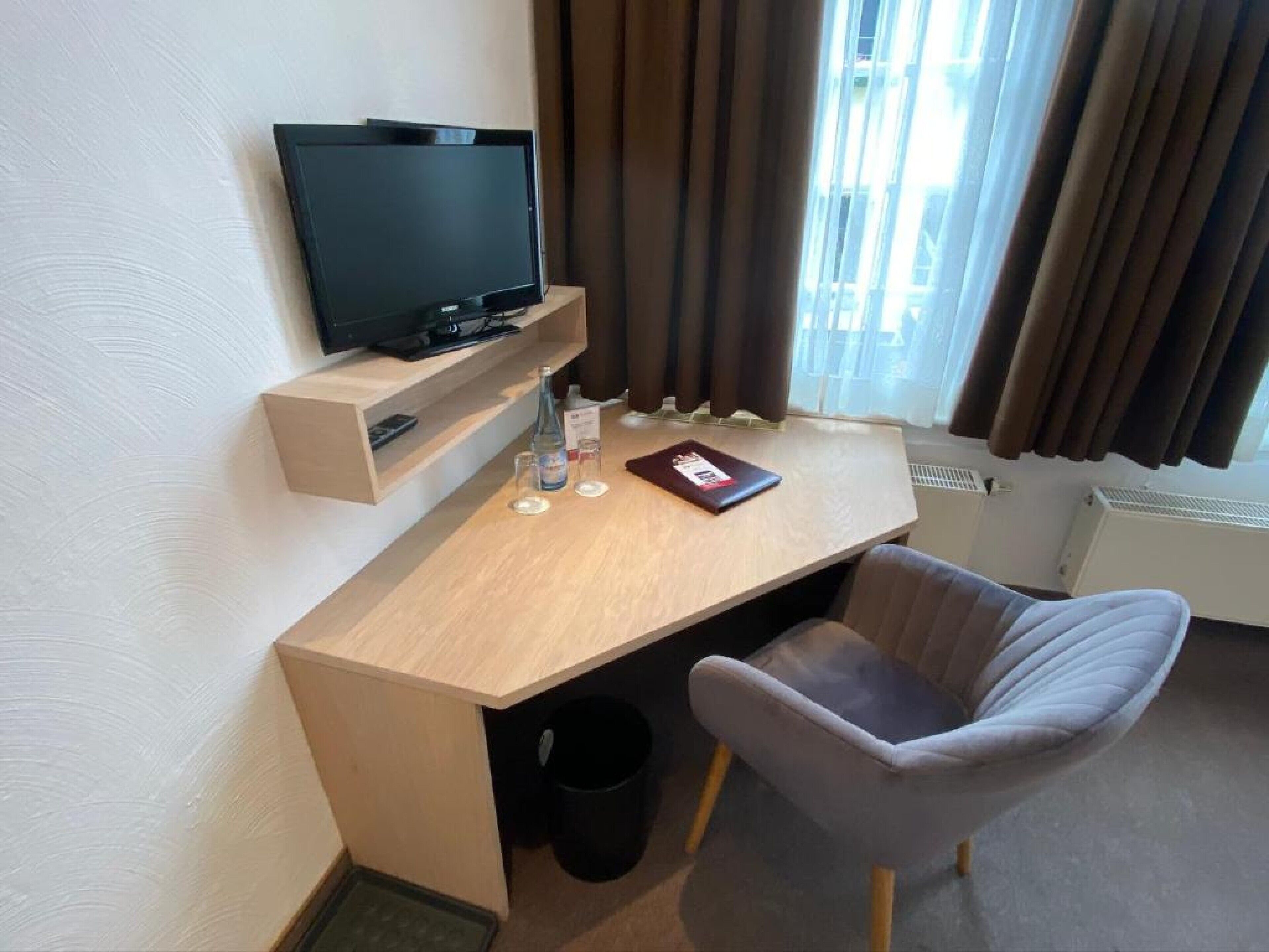 standard double room | living area | flat-screen tv