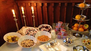 A breakfast buffet with various food items and condiments. - Hotel Horchem (Monschau)
