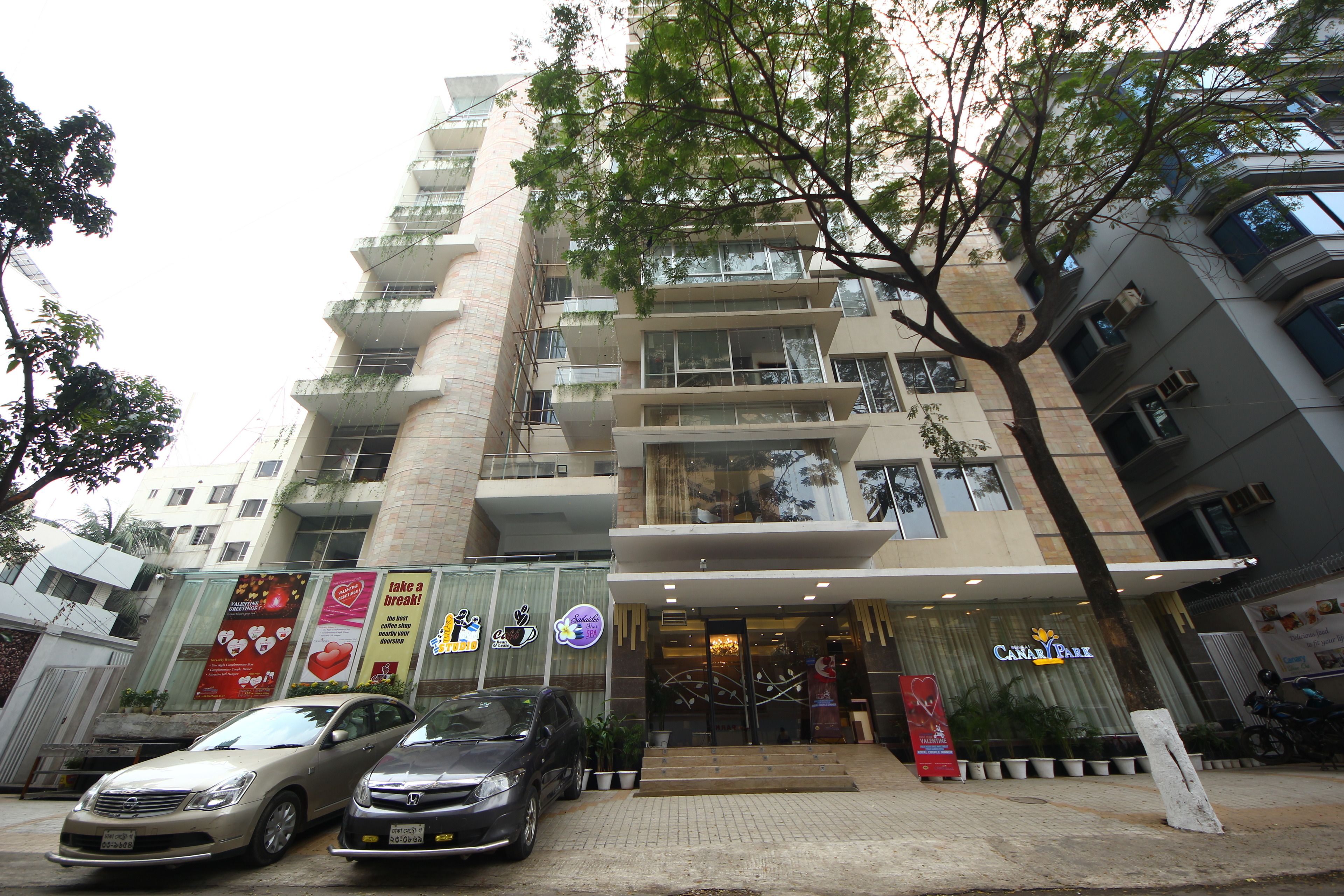 A multi-story hotel with a modern facade, a visible entrance, and a sign for 'Cairo Palace'.