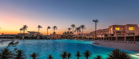 Outdoor pool, a natural pool, pool umbrellas, sun loungers