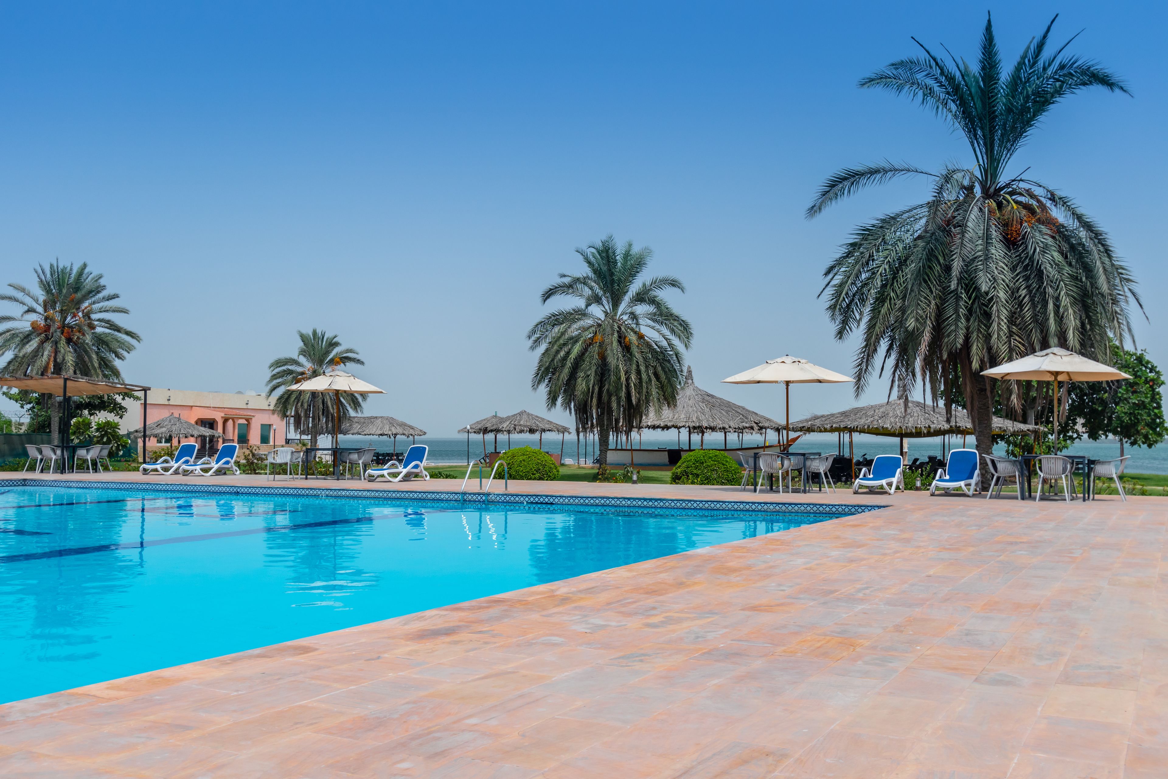 Outdoor pool, pool umbrellas, sun loungers