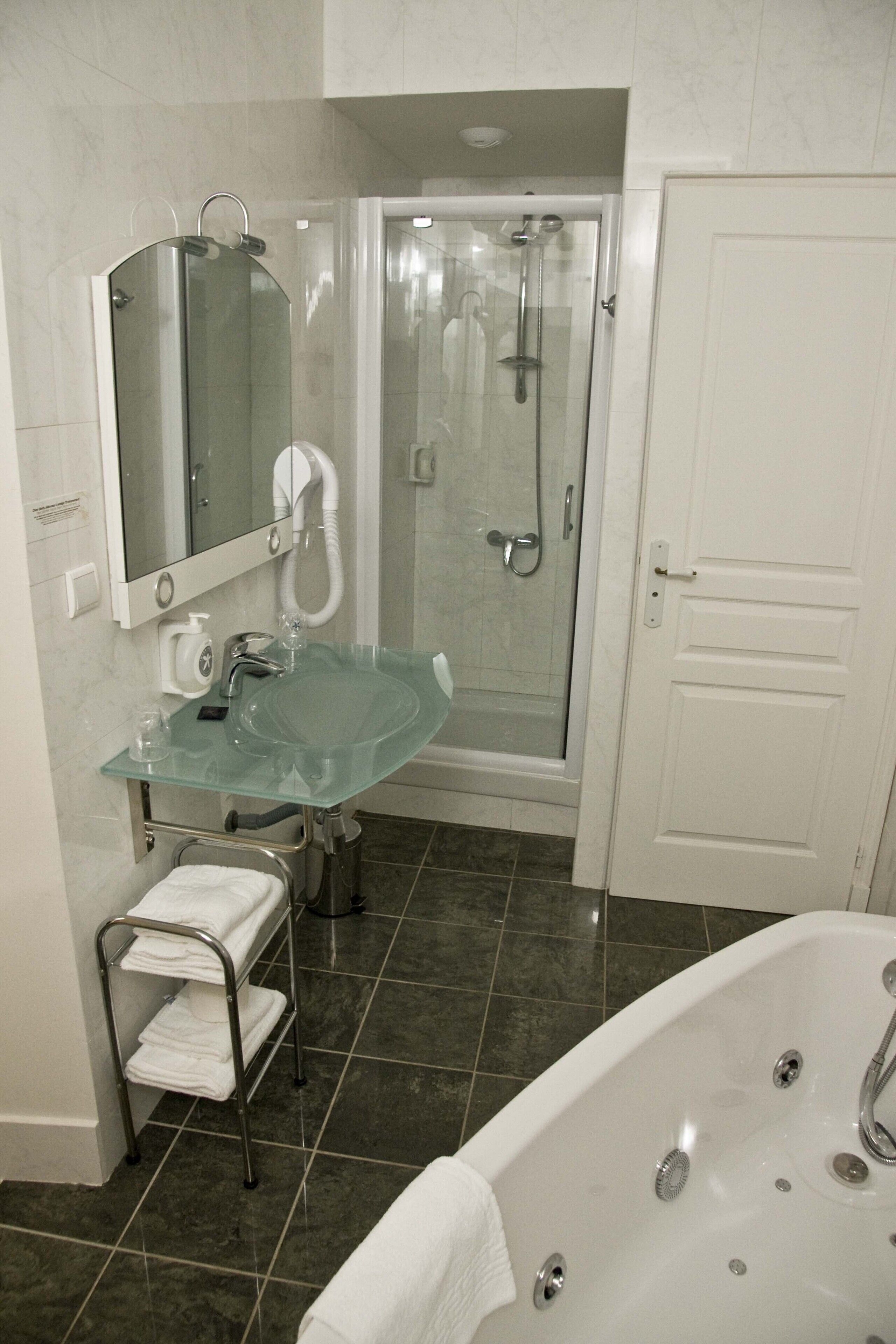 superior double room | bathroom | shower, free toiletries, hair dryer, towels