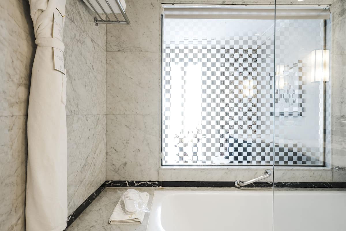 designer toiletries, hair dryer, bathrobes, slippers