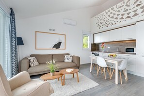 Loft Suite, Terrace, Sea View | Living room | Flat-screen TV