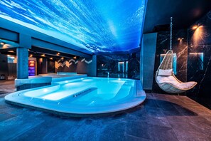 Indoor pool, open 9:00 AM to 9:00 PM, pool loungers