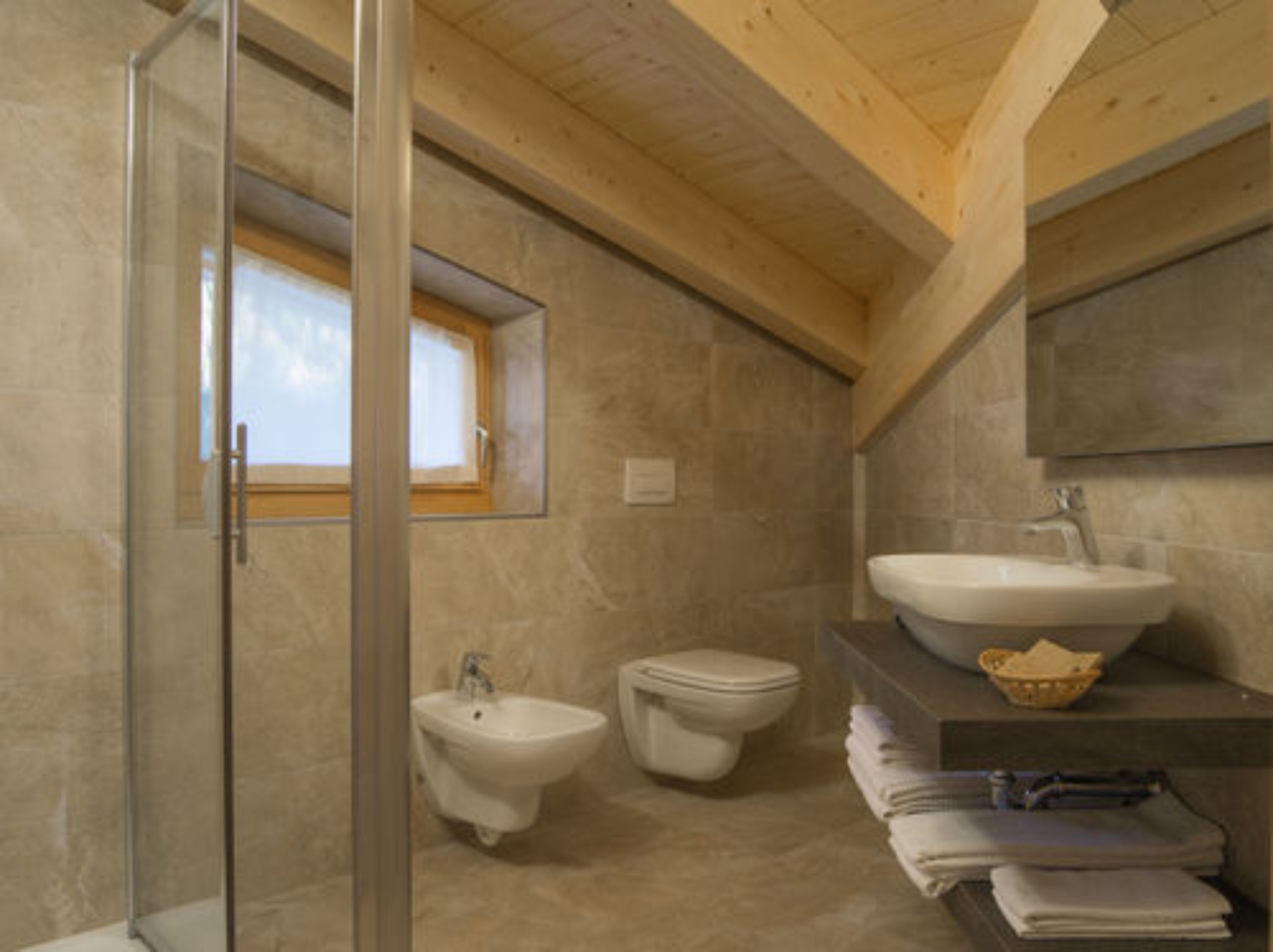 shower, hair dryer, bidet, towels