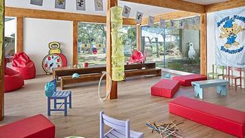 Children can play and explore in this spacious room with a large window offering a view of the outdoors.