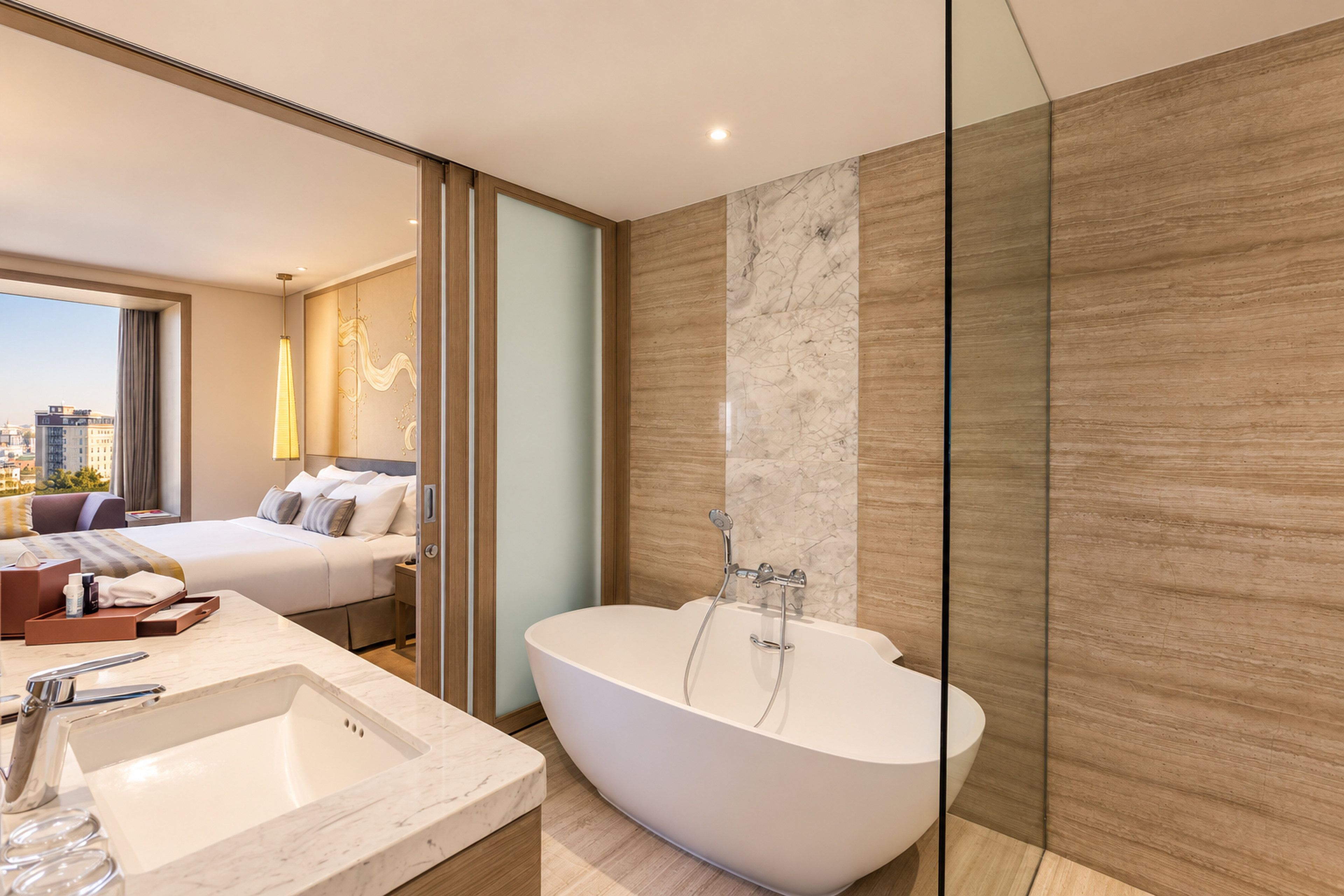 A modern bathroom with a freestanding bathtub, a large mirror, and a view of the city.