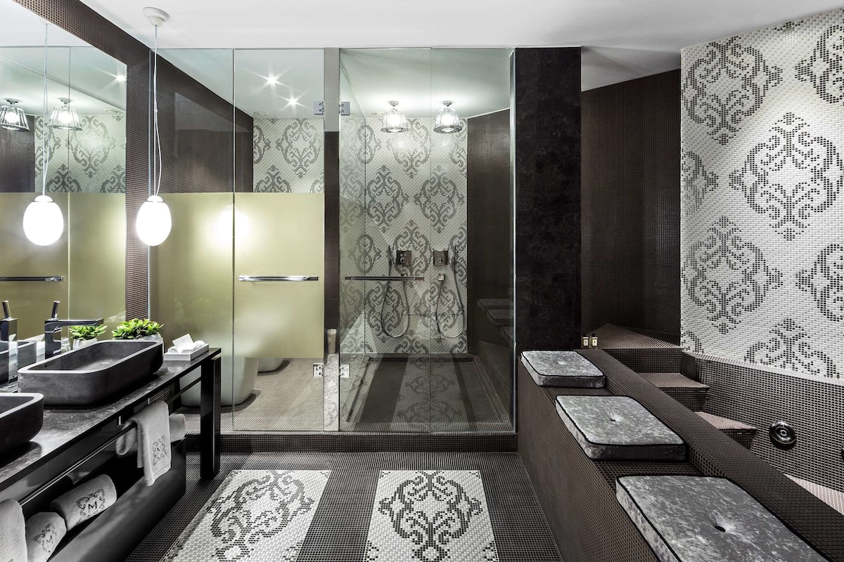 designer toiletries, hair dryer, bathrobes, slippers