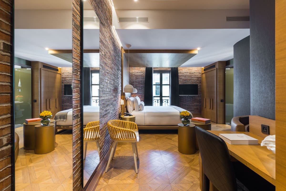 deluxe double room | living area | 42-inch flat-screen tv with satellite channels, smart tv, pay films