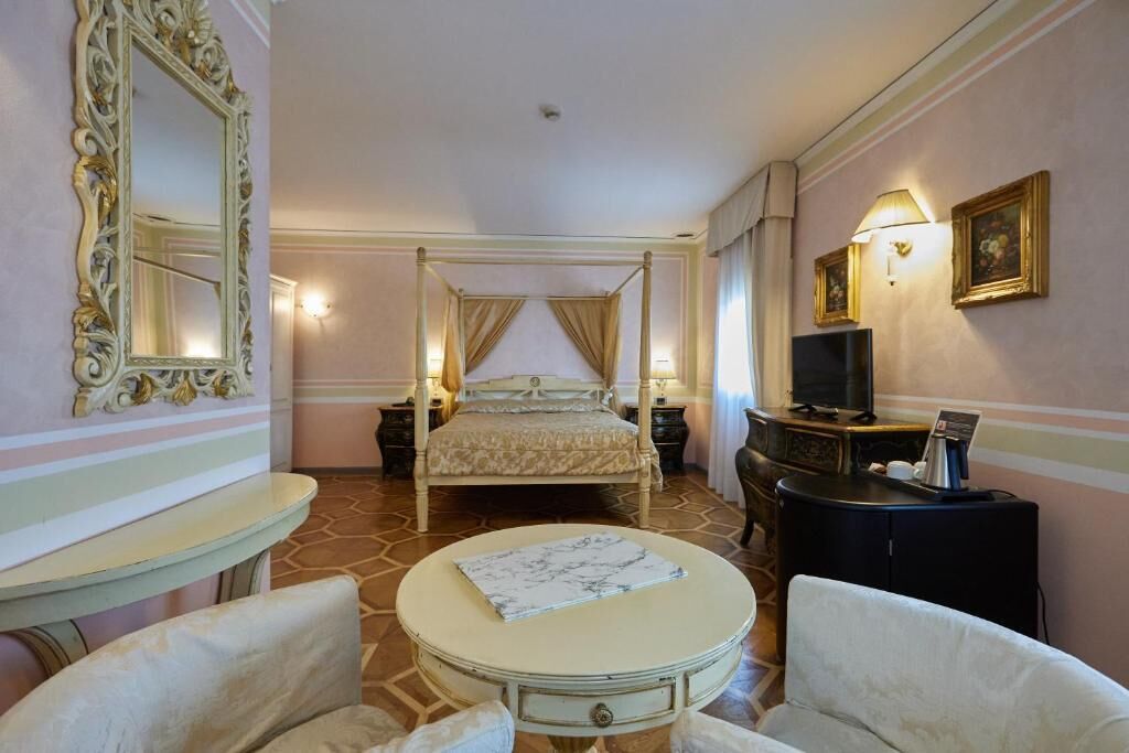 junior suite, 1 king bed, ensuite, garden view | 1 bedroom, premium bedding, minibar, in-room safe