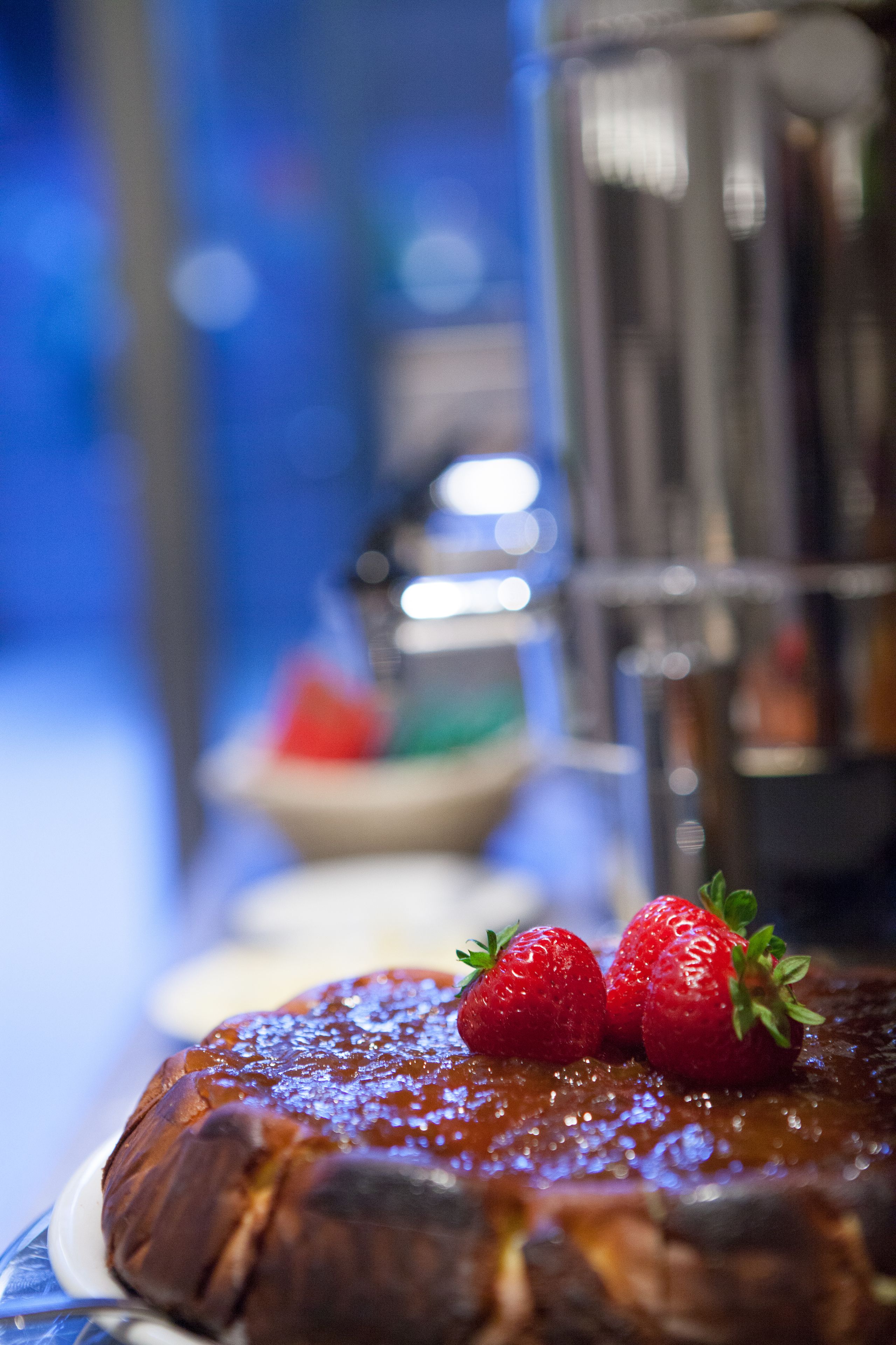 A dessert with strawberries on top, placed on a plate.