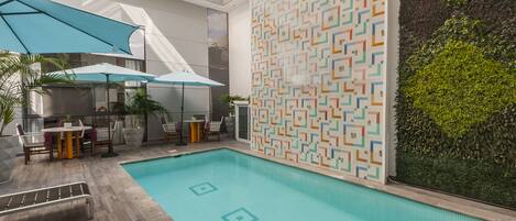Outdoor pool, open 9:00 AM to 9:00 PM, pool loungers