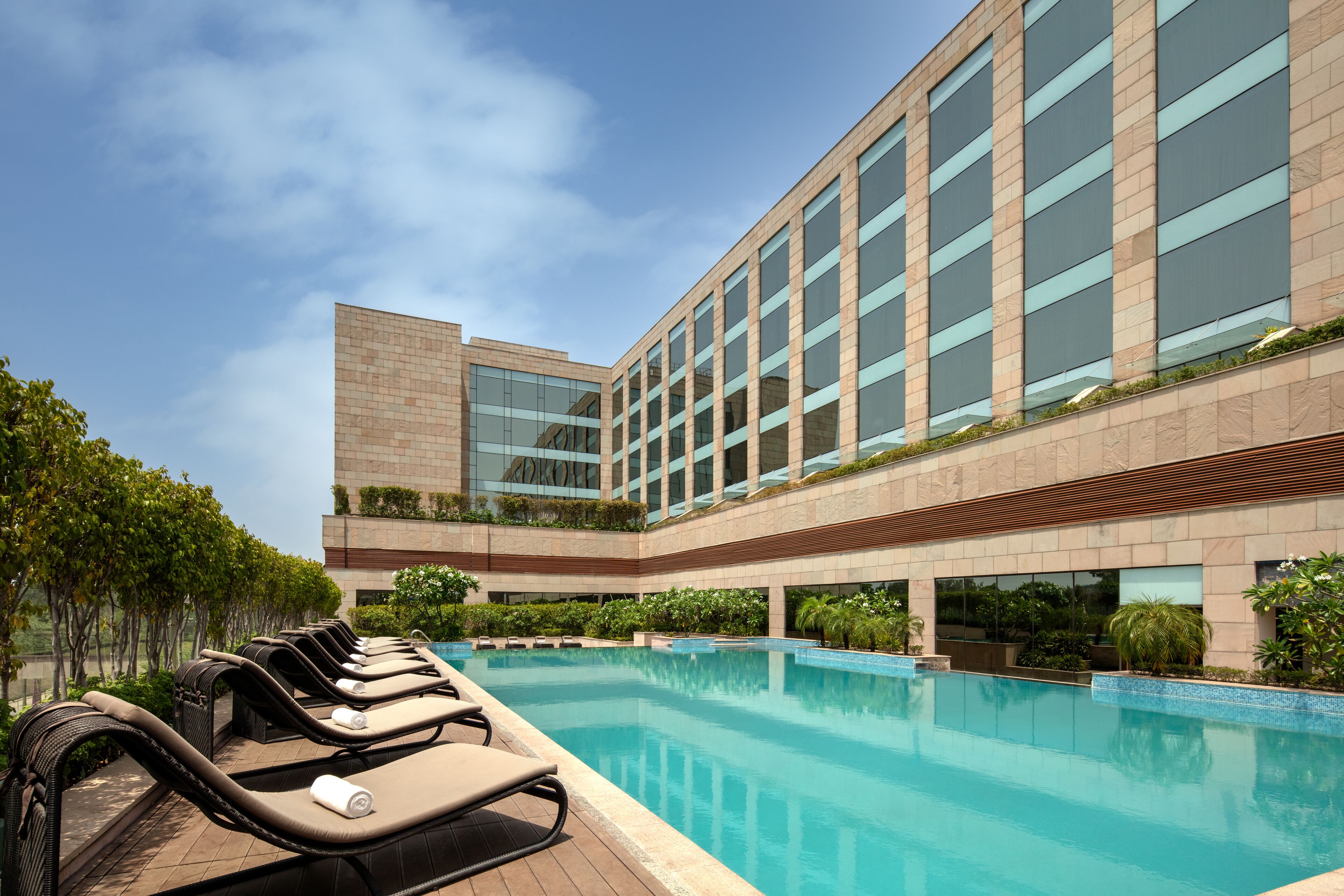 Outdoor pool, open 8:00 AM to 10:00 PM, pool umbrellas, sun loungers