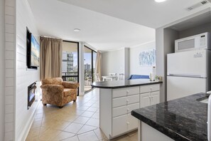 Superior Condo, 1 Bedroom, Balcony, Partial Ocean View | Living area | 55-inch flat-screen TV with cable channels, TV - Meridian Plaza by Hosteeva (Myrtle Beach)