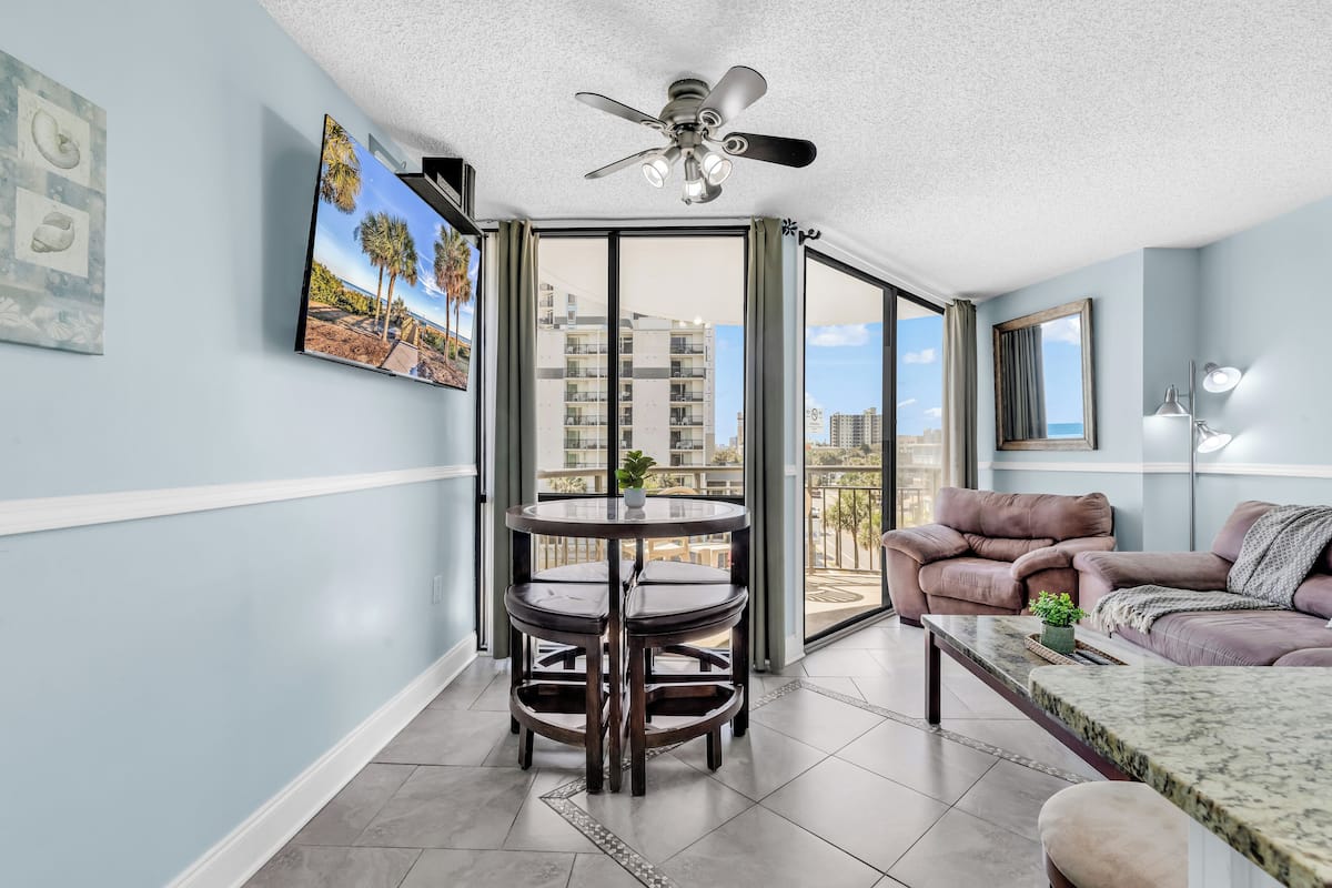 Family Condo, 1 Bedroom, City View, Beachfront | Living room | 55-inch flat-screen TV with cable channels, TV