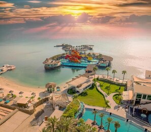 A resort with a water park, swimming pools, and a beach area. - Lagoona Beach Luxury Resort and Spa (Budaiya)