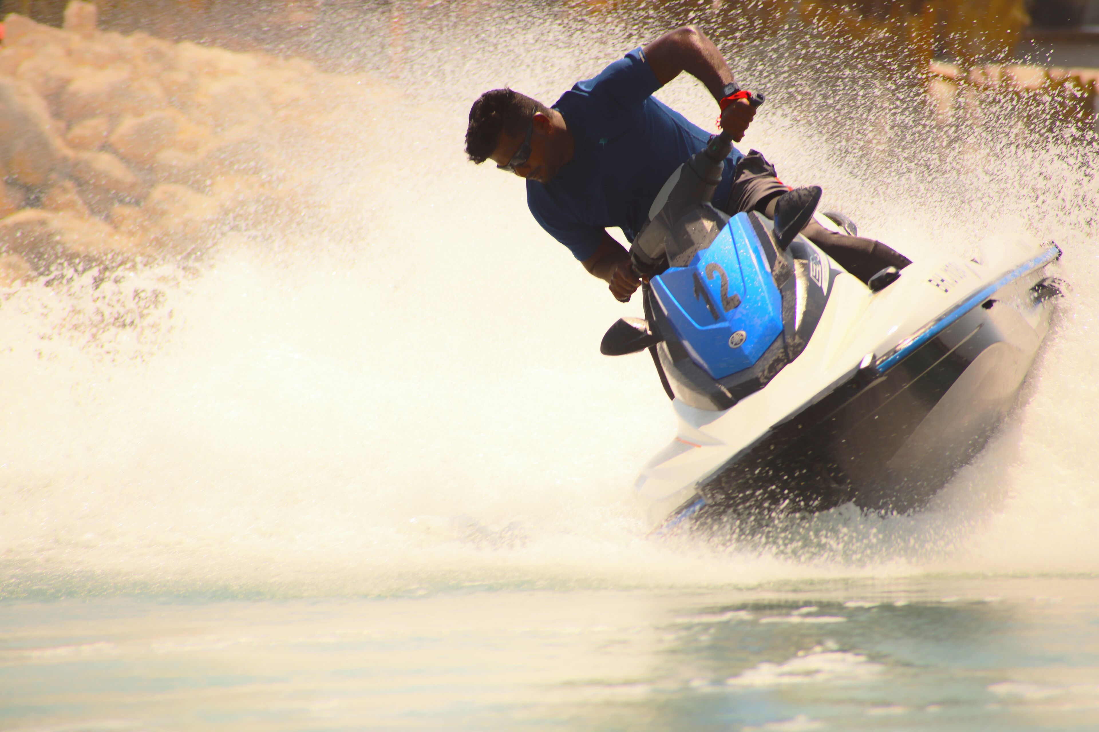 A person riding a jet ski on water.