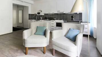 Studio, 2 Single Beds | Living area | Flat-screen TV, DVD player