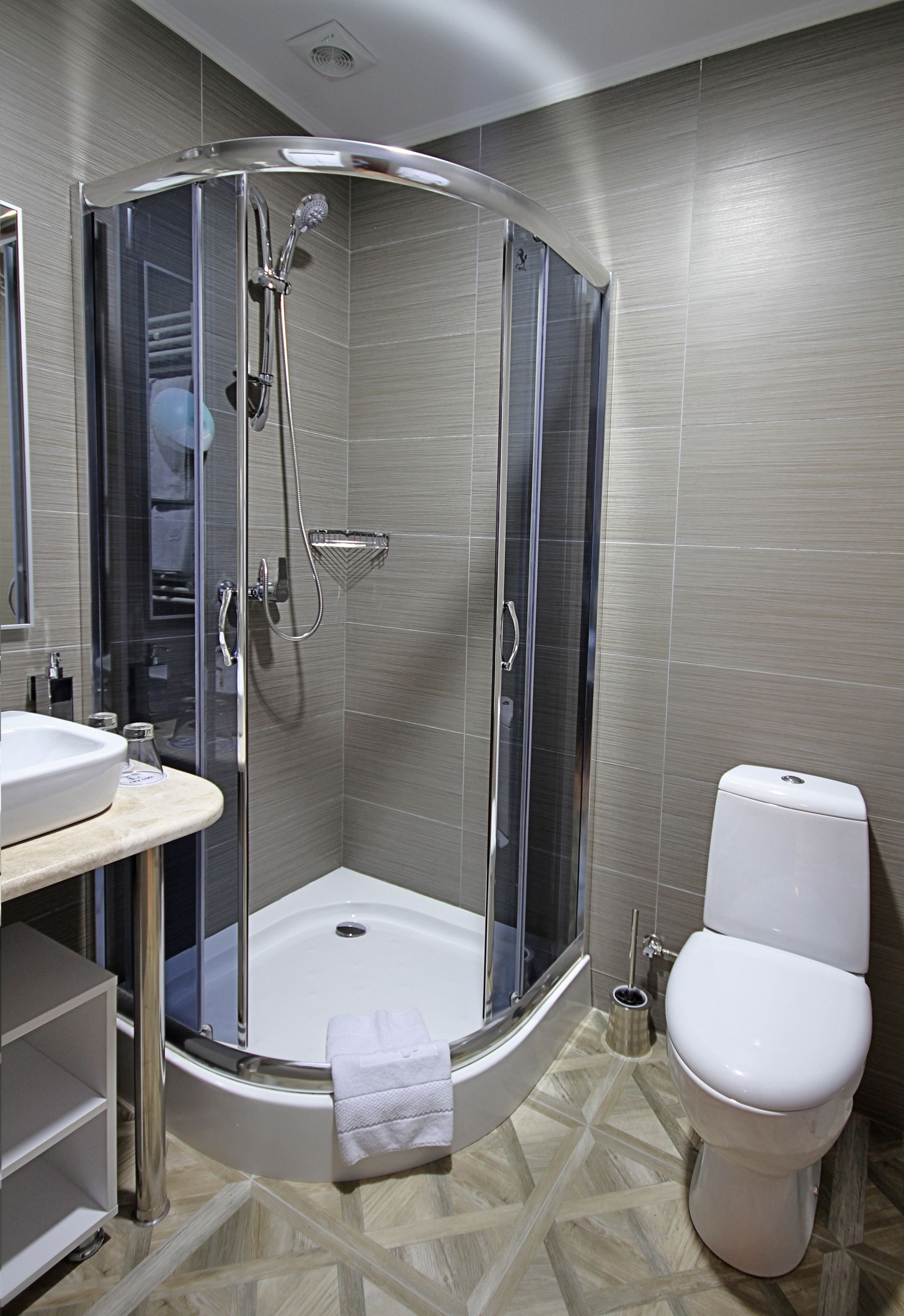 deluxe junior suite | bathroom | shower, hair dryer, bathrobes, slippers
