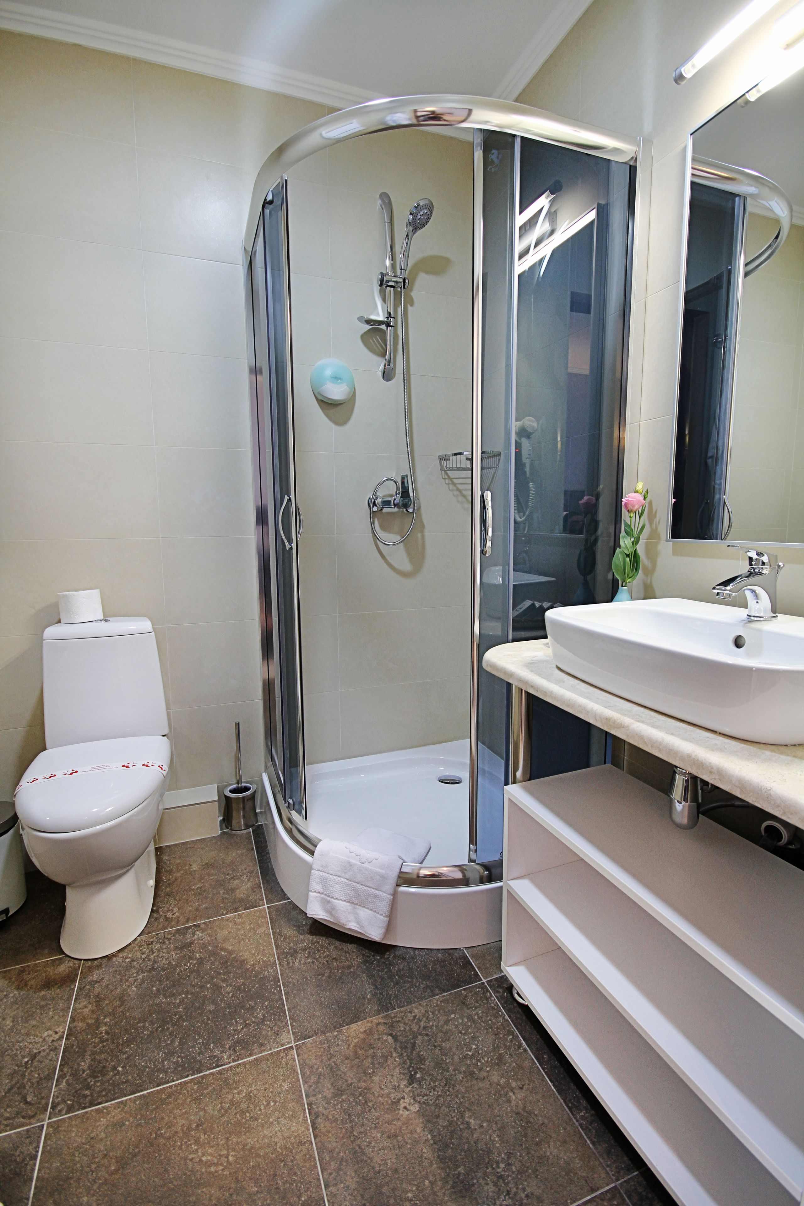 shower, hair dryer, bathrobes, slippers