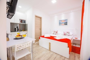 Roupas de cama premium, Wi-Fi de cortesia, roupa de cama