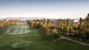 Enjoy a round of golf amidst lush trees and scenic views.