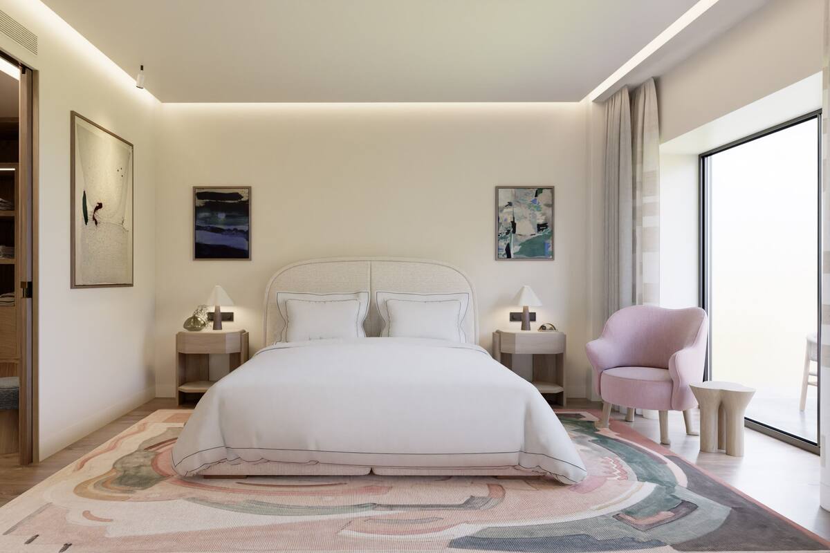 Une chambre moderne avec un grand lit, des tables de chevet, une chaise et une armoire.