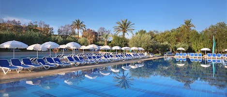 Indoor pool, pool umbrellas, pool loungers