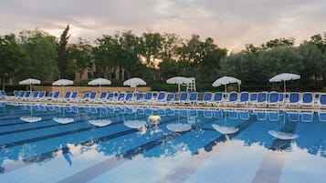 Indoor pool, 4 outdoor pools, open 9:00 AM to 6:00 PM, pool umbrellas