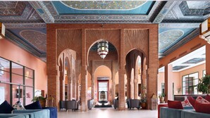 A spacious lobby with high ceilings, intricate ceiling patterns, and a central chandelier. - Valeria Dar Atlas Resort All Inclusive (Marrakech)