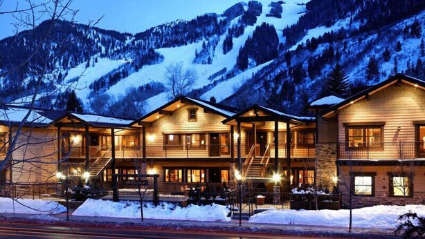 A multi-story lodge with a wooden exterior, multiple balconies, and a ski slope in the background. - The Innsbruck Aspen by Frias (Aspen)