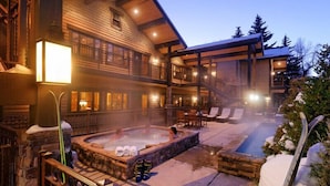 A lodge with a hot tub, outdoor seating, and a staircase leading to the upper level. - The Innsbruck Aspen by Frias (Aspen)