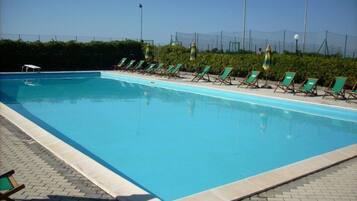 Seasonal outdoor pool, pool umbrellas, sun loungers