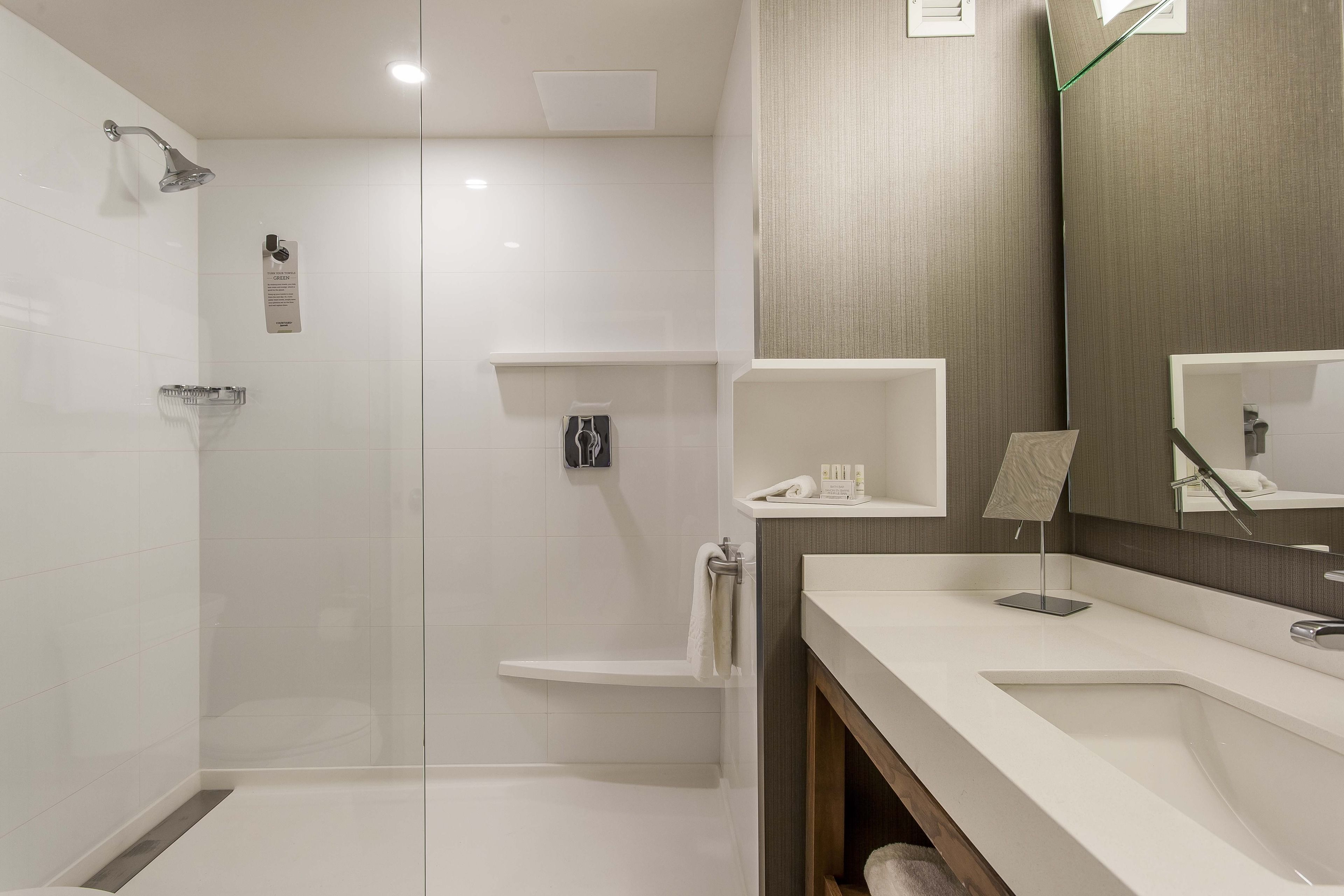 shower, designer toiletries, hair dryer, towels