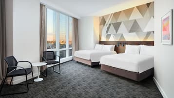 Family Room, 2 Queen Beds, Corner | In-room safe, desk, iron/ironing board, free cribs/infant beds