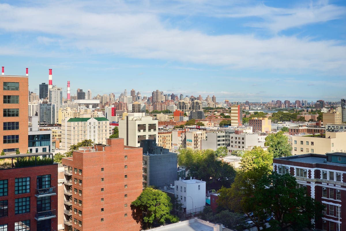 A cityscape with a variety of building styles, including modern and older architecture.