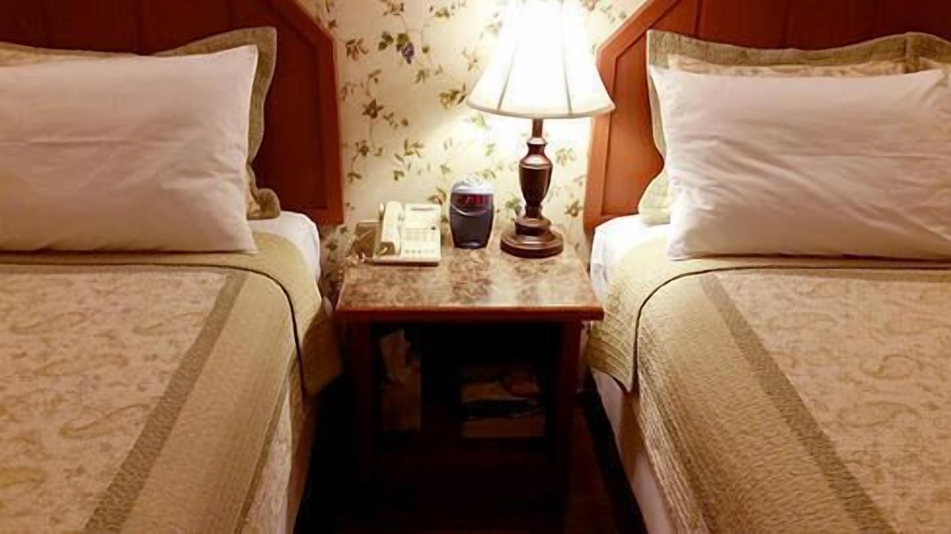 room, 2 queen beds | desk, iron/ironing board, free wifi, bed sheets