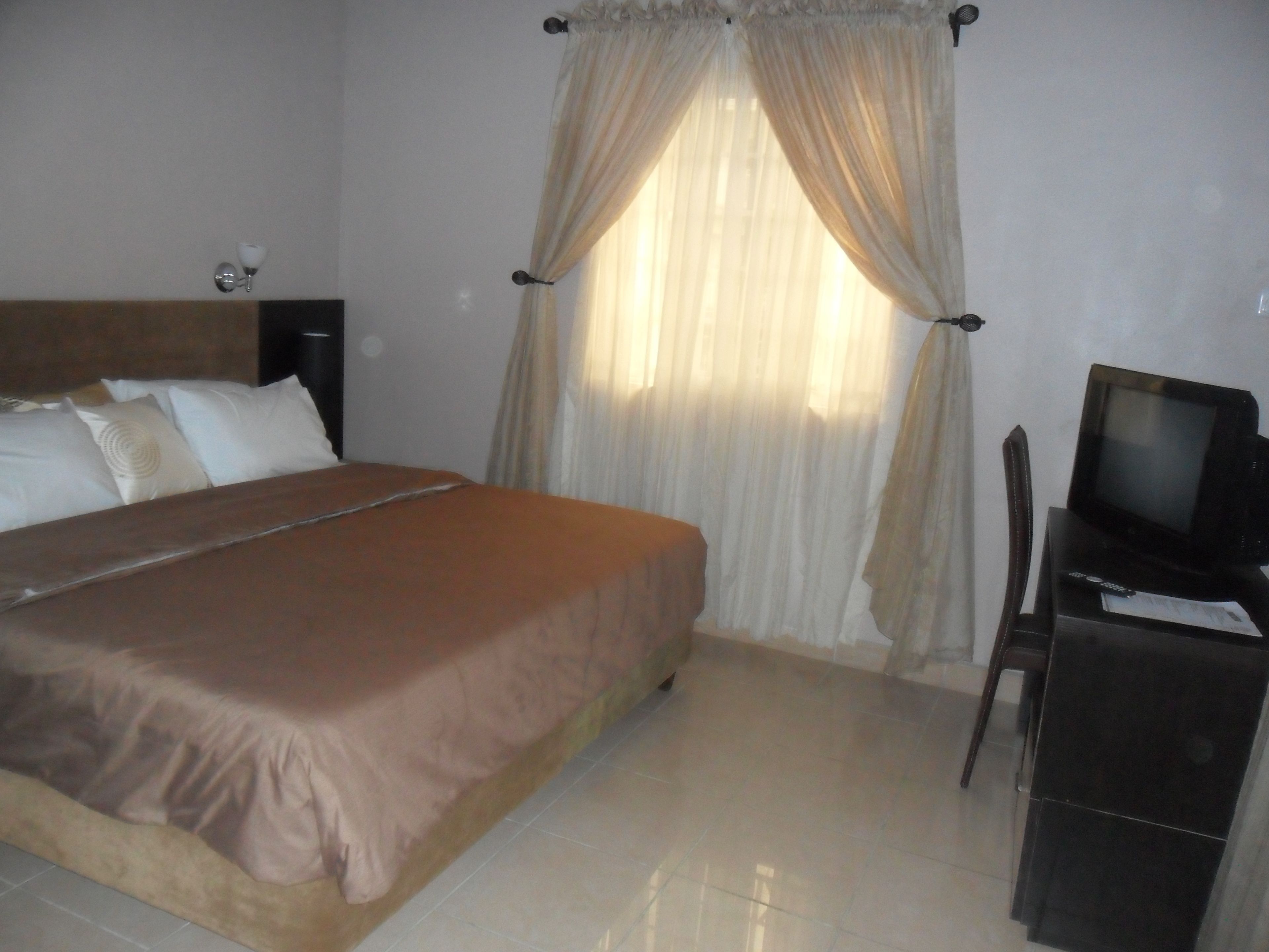 Habitación estándar | Sala de estar | Una televisión de pantalla plana