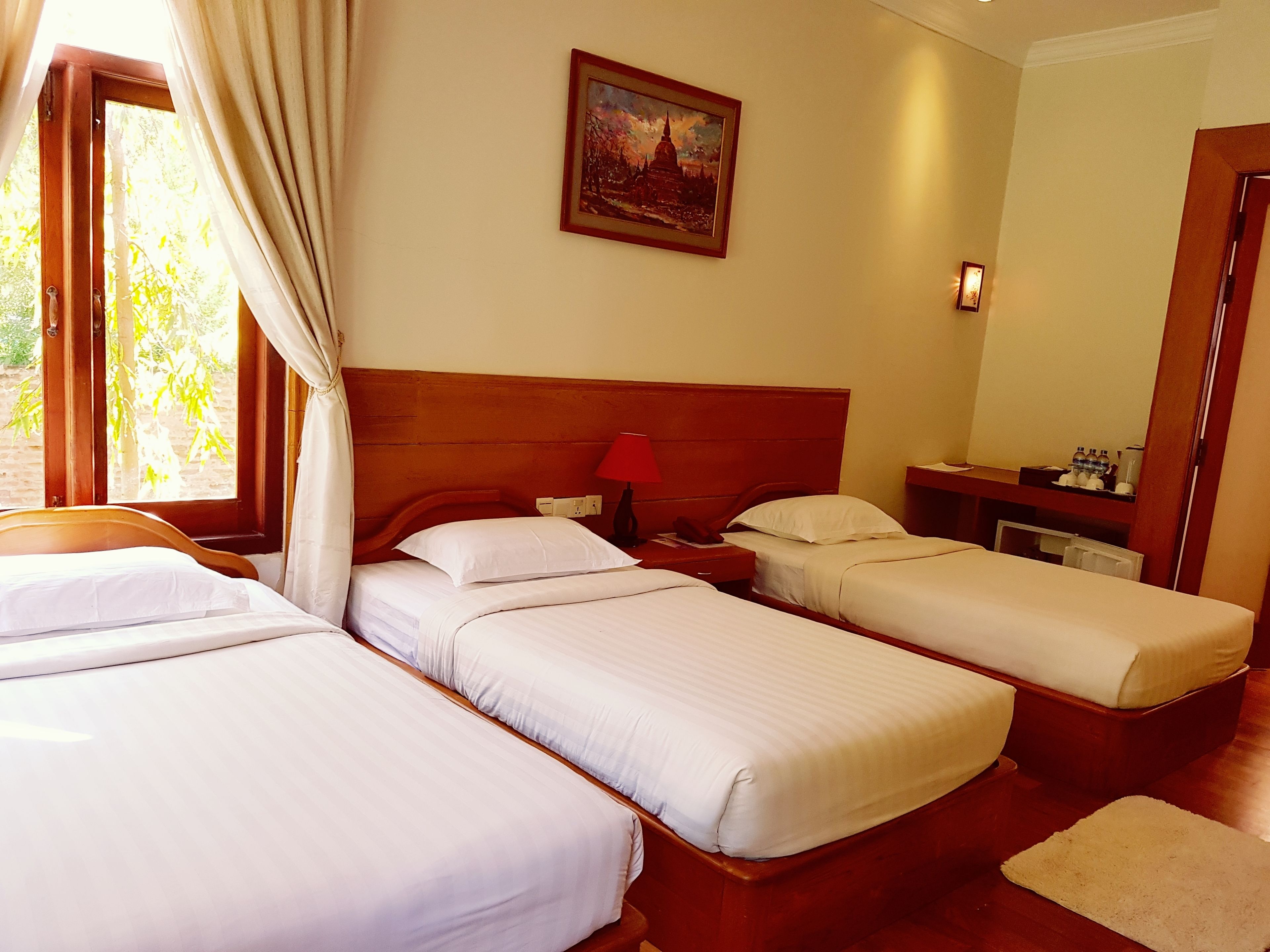 family room | minibar, desk, blackout curtains, iron/ironing board